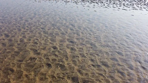 Surface of a shallow river with a sandy bottom Stock Footage 128841553
