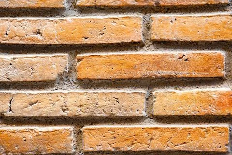 The surface shows a wall made of orange and brown bricks stacked evenly. The  Stock Photos