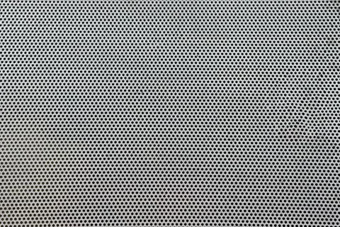 Surface with small holes. Stock Photos