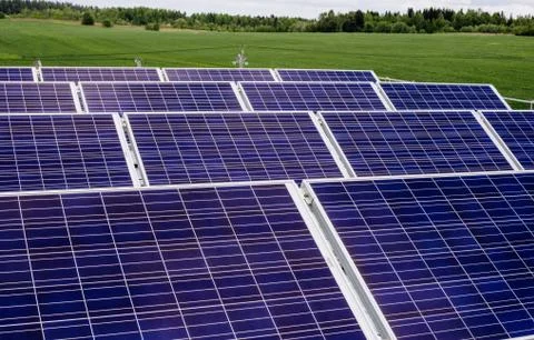 Surface of the a solar panel on field Stock Photos