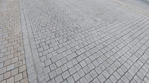 Surface of stone paving blocks on a pedestrian street or sidewalk Stock Footage 333643295
