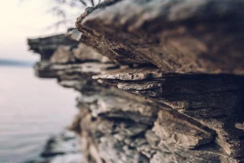 Surface of an stone wall. Black Stone background. Rock texture. Rock pile bac Stock Photos