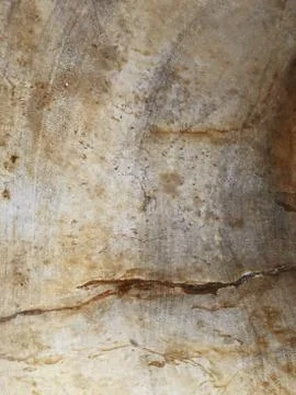 The surface of a stone wall with a spot of copper stain. Stock Photos