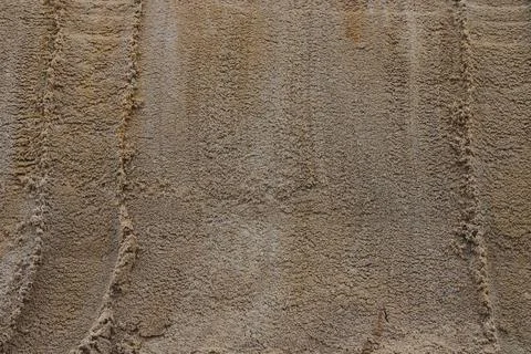 Surface structure of river sand. Large river sand at a construction site. Stock Photos