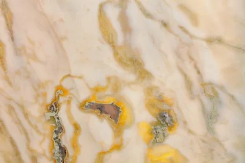 The surface, texture and background of beige marble with brown stains and spl Stock Photos
