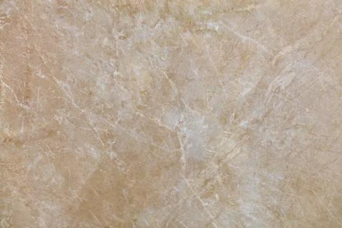 The surface, texture and background of beige marble with small whitish cracks Stock Photos