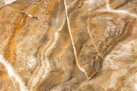 The surface, texture and background of beige and brown marble with cracks a.. Stock Photos