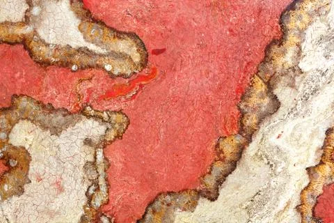 Surface, texture and background of red granite with cracked brown and beige s Stock Photos