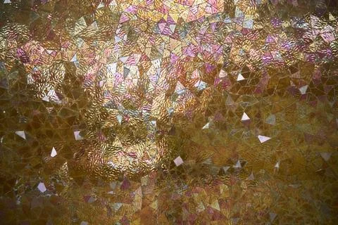 Surface texture with glossy mosaic. Triangular tiles in yellow colors 写真素材