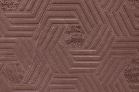 Surface texture with hexagonal pattern of brown geometric shapes Stock Photos