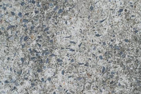 Surface texture of old concrete floor with stone for background. Stock Photos