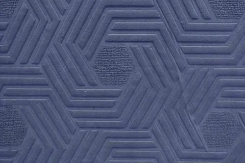 Surface texture with a pattern of dark blue rhombus geometric shapes, backgro Stock Photos