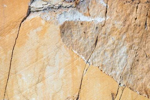 Surface texture of sandstone stone with cracks for background Stock Photos