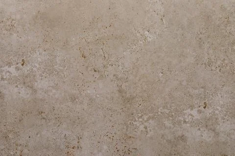 Surface of textured beige concrete with subtle patterns and imperfections Stock Photos