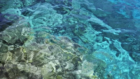 The surface of transparent sea water through which the bottom is visible. Mar Stock Footage 163452402