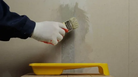 Surface treatment of the wall Stock Footage 129697713