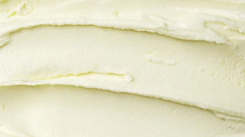 The surface of vanilla ice cream is spread with spatula Stock Footage 260327729