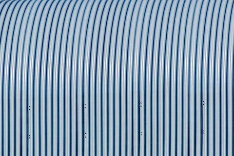 The surface of the vertical tubes is rounded at the top Stock Photos