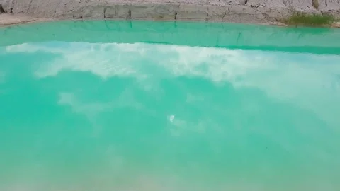 Surface view of vibrant turquoise water in kaolin clay lake background Stock Footage 344812275