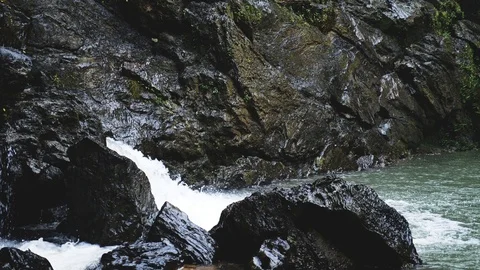 Surface view of a waterfall, in a rain forest in India Stock Footage 118435996
