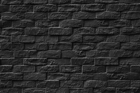 Surface of Vintage black brick wall background. Stock Photos