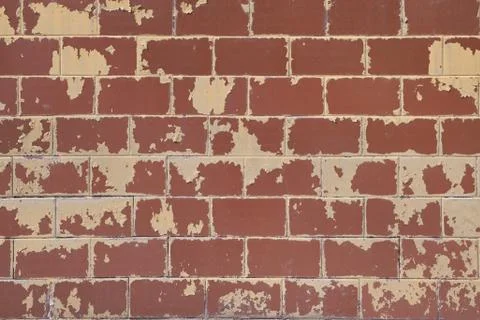 The surface of the wall of the building is lined with rectangular tiles. Stock Photos