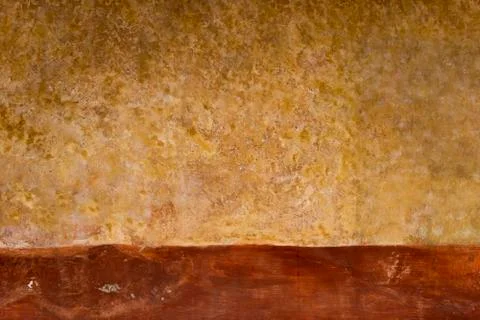 Surface of a wall of an old house with texture and in warm tones. Stock Photos