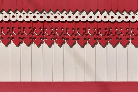 The surface of the wall or fence decorated with carved wooden boards patterns Stock Photos