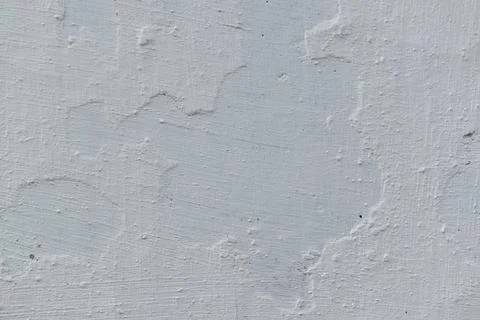 Surface of the wall is whitewashed over the old paint. Stock Photos
