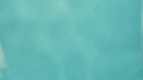 On the surface of water with drops. on a blue background Video stock 220369901