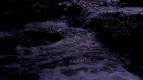 The surface of the water of a mountain river. A fast stream flowing through ston Stock Footage 219501564