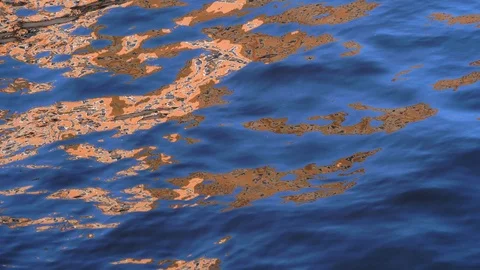 The surface of the water sways in the wind. Reflections on the water. Stock Footage 121005213