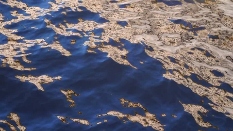 The surface of the water sways in the wind. Reflections on the water. Stock Footage 121007108