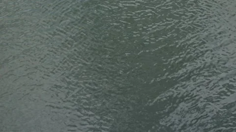 The surface of water with various patterns and reflections. The movement of the Stock Footage 339094309