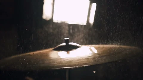 Surface of a wet drum cymbal while being played in a close up Stock Footage 148278844