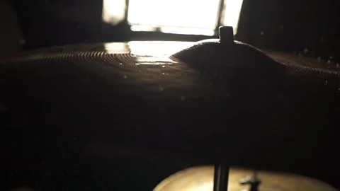 Surface of a wet drum cymbal while being played in a close up Stock Footage 263201335