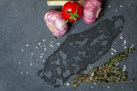 Surface, on which lay the meat with fresh herbs and salt Stock Photos