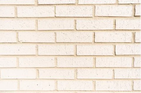 Surface of white brickwall. Textured beige brick backdrop. Wall texture Stock Photos