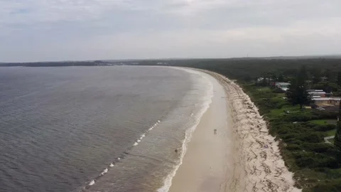 Surface of white sand Callala beach in low tide – aerial flying waterfront 4k. Stock Footage 171776907