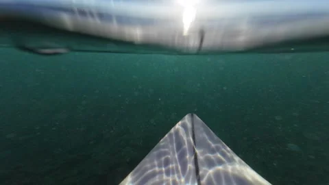 Surfboard going underwater in Maui Stock Footage 294896231