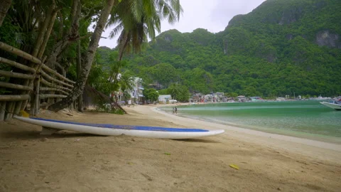 Surfboard lying on the sand Stock Footage 281258997