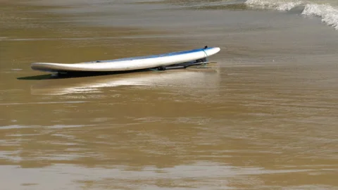 Surfboard on the sand on the beach Stock Footage 277351029