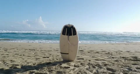 Surfboard on sand in surf beach. Stock Footage 213661236