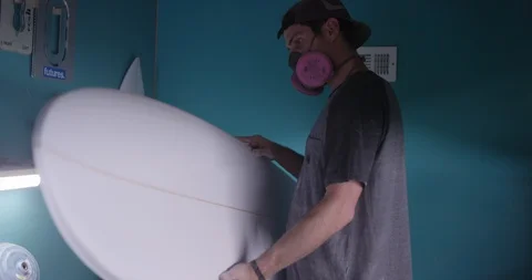 Surfboard shaper Man making a surfboard in a workshop Stock Footage 107639658