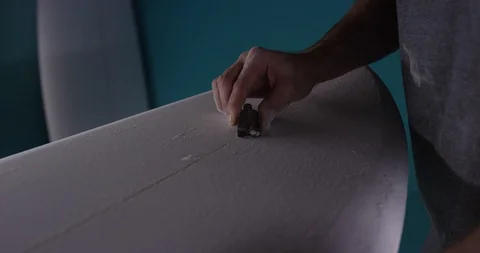 Surfboard shaper Man making a surfboard in a workshop Stock Footage 107640339