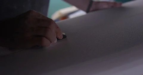 Surfboard shaper Man making a surfboard in a workshop Stock Footage 107640713
