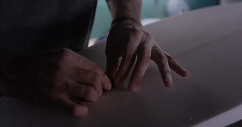Surfboard shaper Man making a surfboard in a workshop Stock Footage 107640949