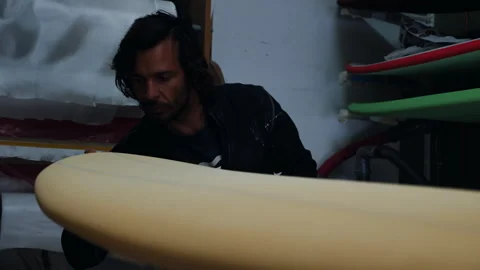 Surfboard shaping process captured with craftsmanship and skill Stock Footage 321571410