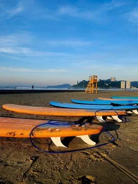 Surfboards being prepared for a surf session on the beach Stock Photos