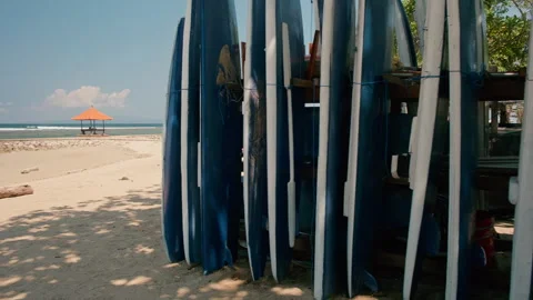 Surfboards beside sandy beach , Sunar Beach, Bali Vidéo 336514927